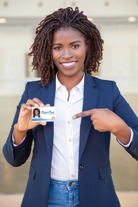 Woman holding photo ID badge